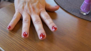BigSandra Applying dark red nail polish