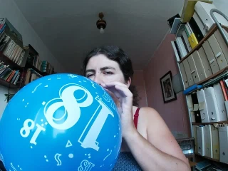 Charmella Blowing a balloon