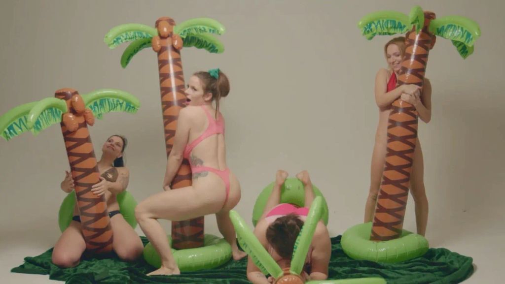 4 girls with inflatable palm trees
