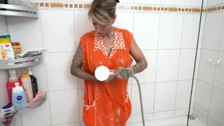 SandyFetish ShowerinClothes Gown - Horny shower in orange nylon gown